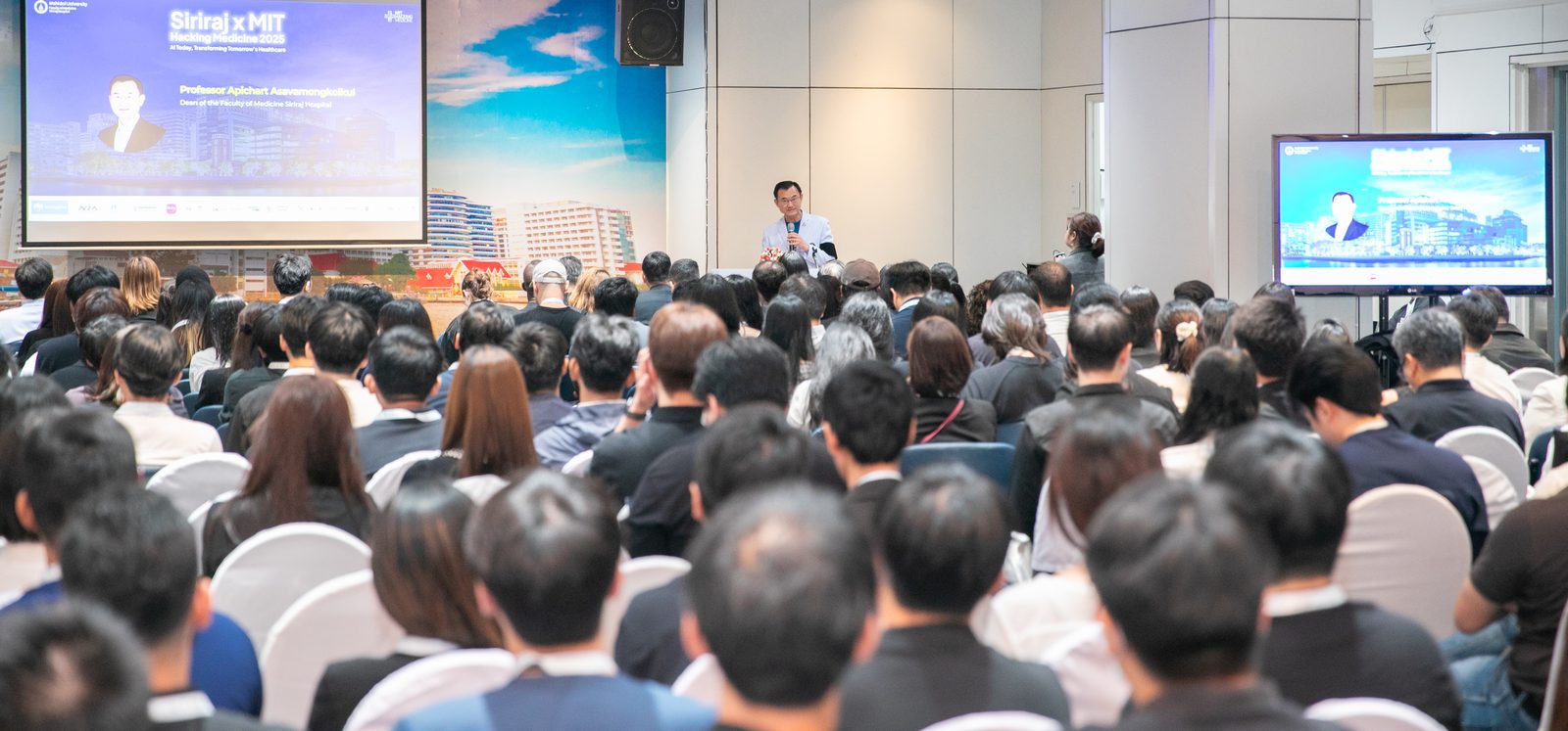 A summit session in a hotel ballroom